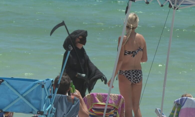 A Florida man wears a Grim Reaper suit and wants the governor to make masks mandatory